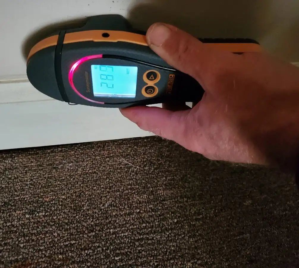 Moisture detection at baseboard during Storm Damage Restoration in Placerville
